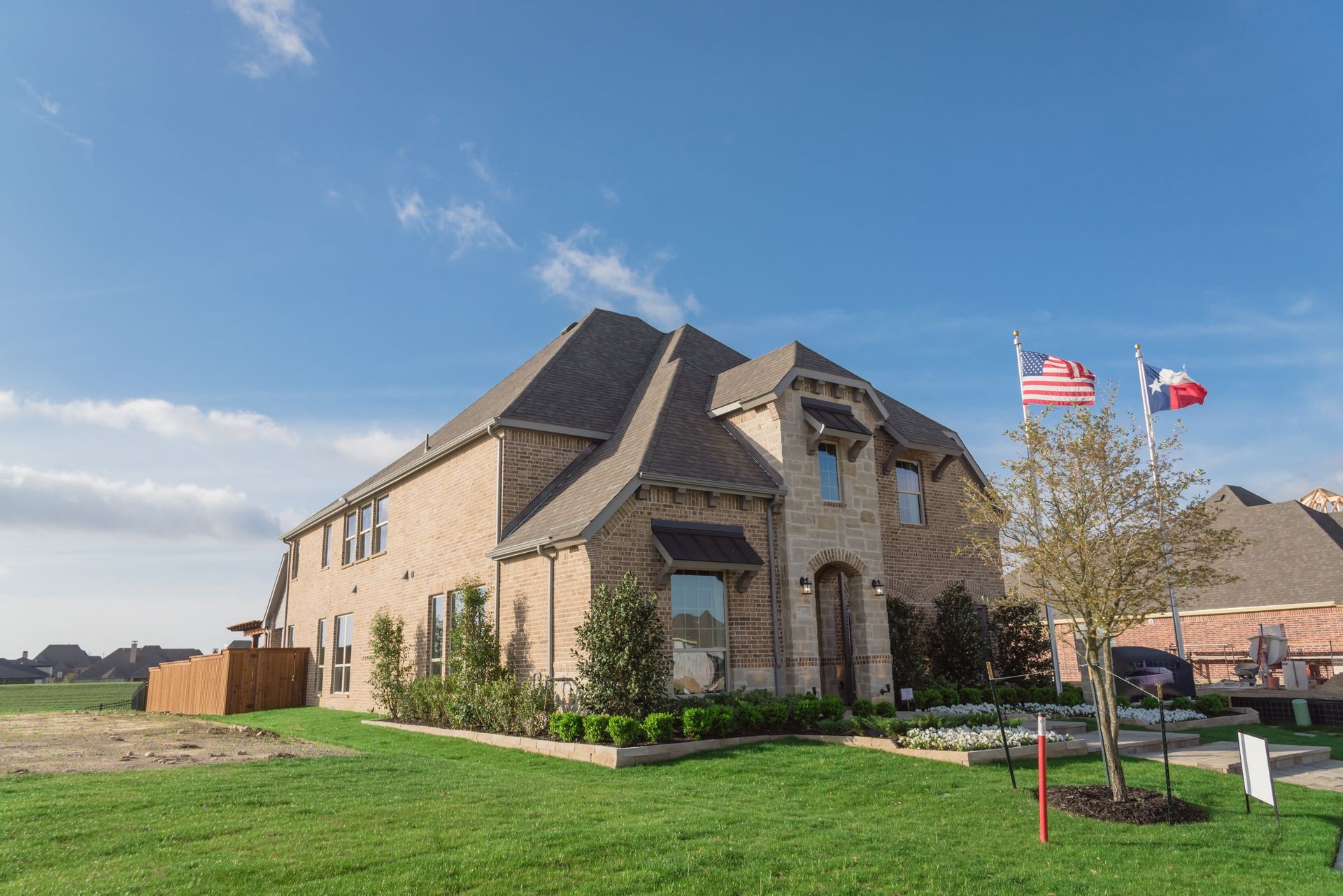 Model home and construction office of new boutique community neighborhood in Irving, Texas, USA. Brand new two story residential house, newly constructed, freshly built with landscaped yard
