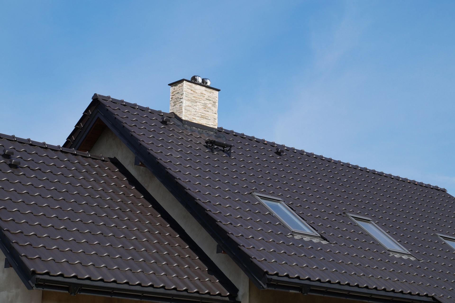 The roof in a newly built building made of ceramic tiles. The roof in a newly built building made of ceramic tiles.